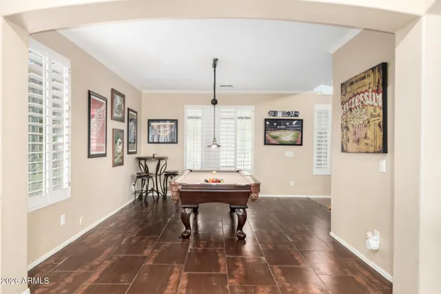 a kitchen with a table chairs and wooden cabinets