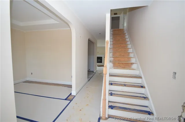 a view of staircase with white walls and stairs
