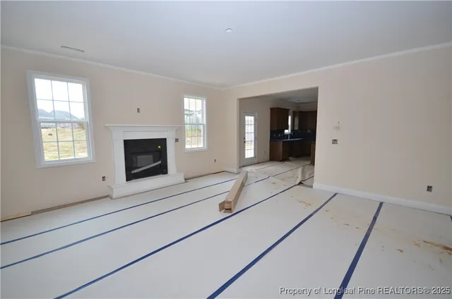 an entryway with fireplace and window