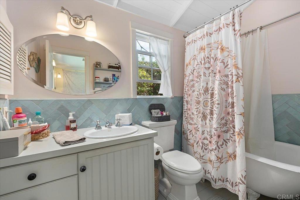 845 Crescent Drive Vista, CA 92084 - Photo 13 of 22 a bathroom with a sink toilet and a mirror