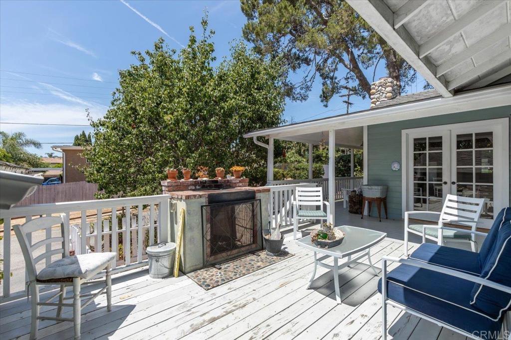 845 Crescent Drive Vista, CA 92084 - Photo 17 of 22 a balcony with wooden floor and furniture