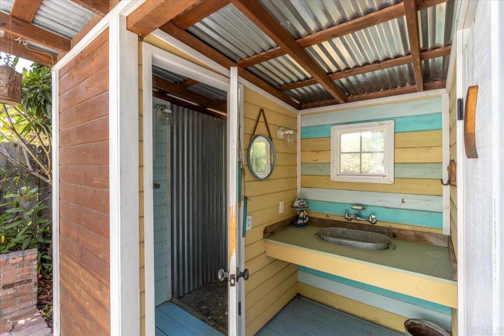 845 Crescent Drive Vista, CA 92084 - Photo 20 of 22 a bathroom with a sink and a mirror
