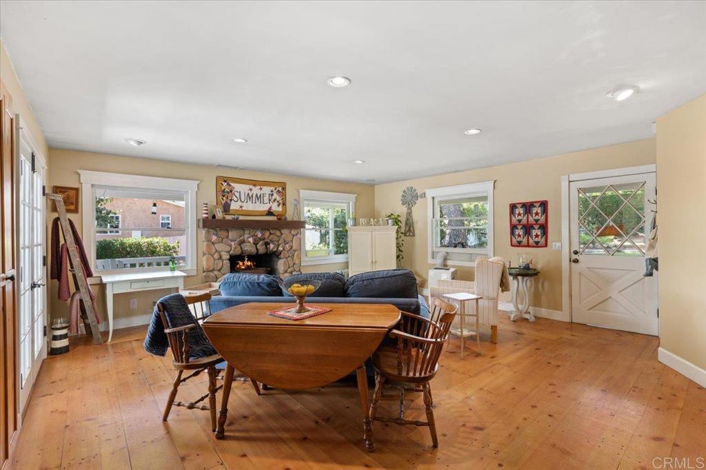 845 Crescent Drive Vista, CA 92084 - Photo 4 of 22 a living room with furniture a flat screen tv and a large window