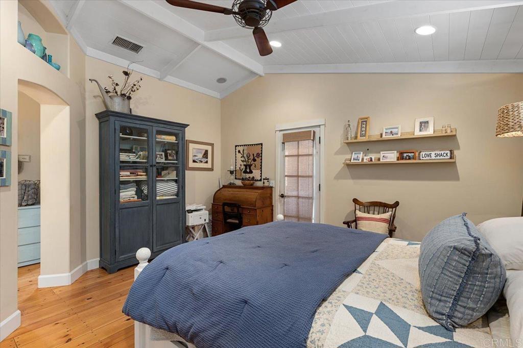 845 Crescent Drive Vista, CA 92084 - Photo 8 of 22 a bed room with a bed furniture and a kitchen