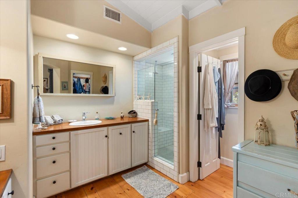 845 Crescent Drive Vista, CA 92084 - Photo 9 of 22 a bathroom with a toilet a sink and mirror