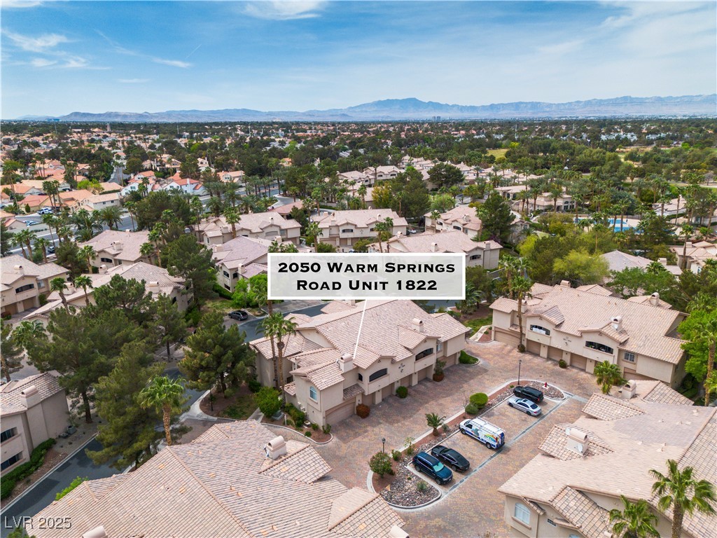 2050 West Warm Springs Road, Unit 1822 Henderson, NV 89014 - Photo 47 of 55 Drone / aerial view featuring a mountain view and a residential view