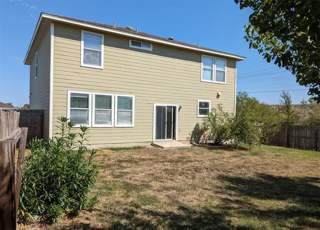 a view of a backyard of the house