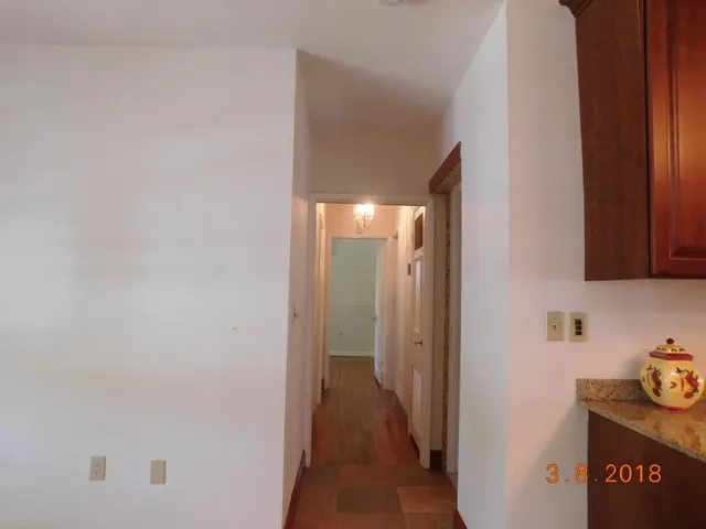 a view of a hallway to other door