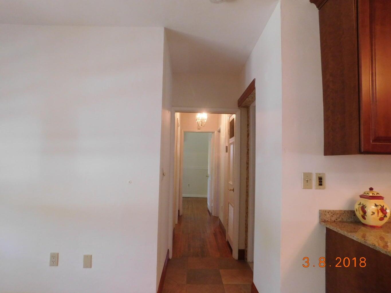 6608 Southwest 65th Street South Miami, FL 33143 - Photo 11 of 25 a view of a hallway to other door