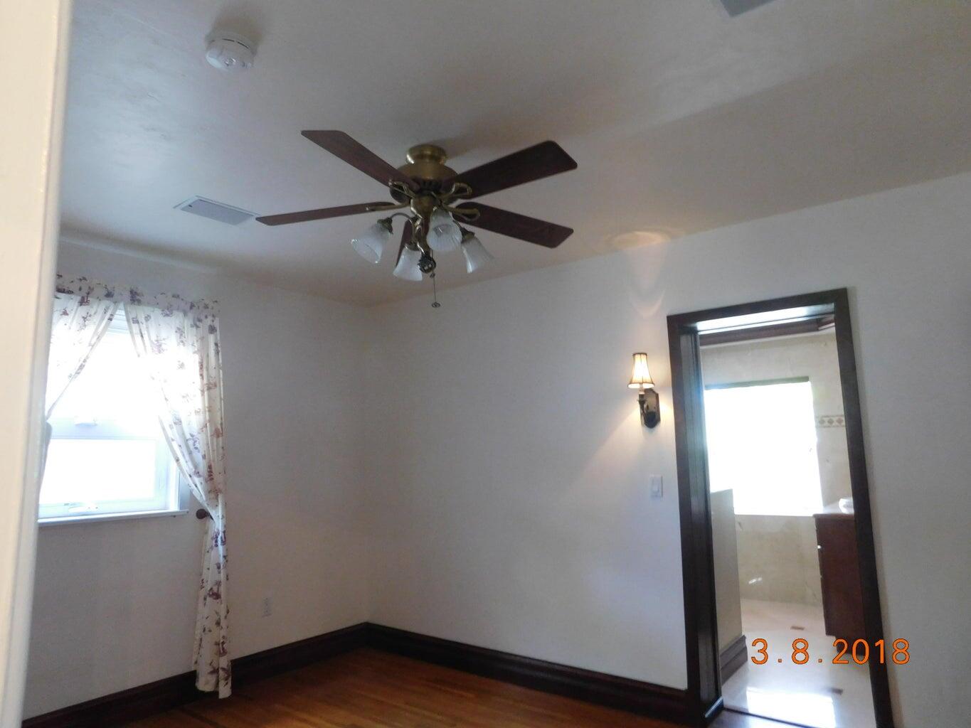 6608 Southwest 65th Street South Miami, FL 33143 - Photo 13 of 25 a view of empty room with wooden floor and fan