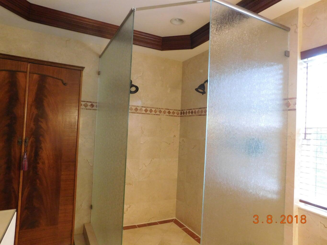 6608 Southwest 65th Street South Miami, FL 33143 - Photo 14 of 25 a bathroom with a shower and a glass door