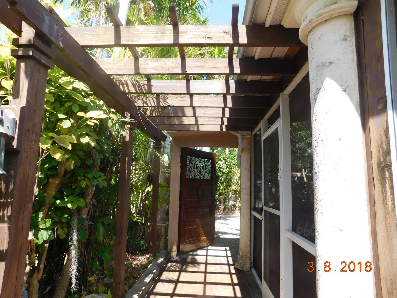 6608 Southwest 65th Street South Miami, FL 33143 - Photo 2 of 25 a view of an entryway
