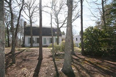 44 Joshua Jethro Road Harwich, MA 02645 - Photo 3 of 21 a view of a house with trees in the background