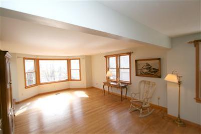 44 Joshua Jethro Road Harwich, MA 02645 - Photo 8 of 21 a view of an empty room with a window and wooden floor