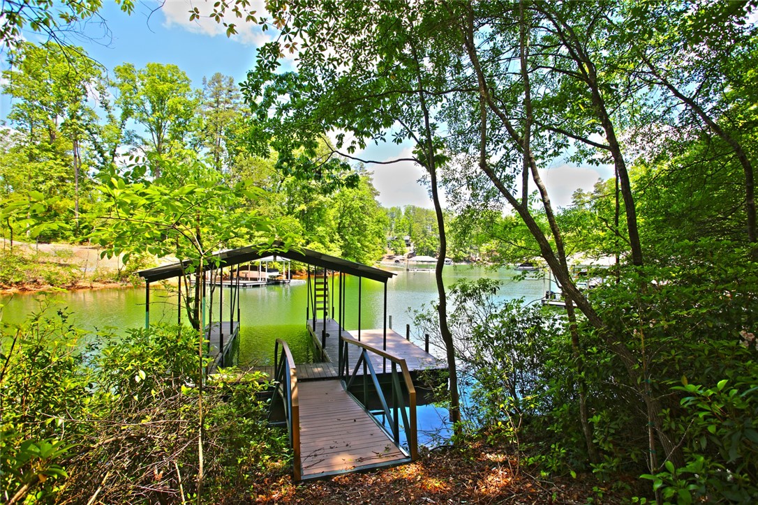 Lot 114 Harbor Point Seneca, SC 29672 - Photo 20 of 46 This serene waterfront property offers direct access to the lake with a private boat dock.