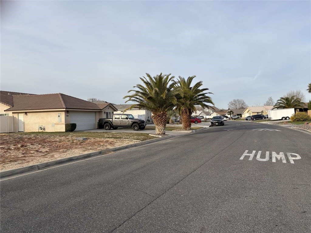 13089 Bermuda Dunes Road Victorville, CA 92395 - Photo 2 of 5 a view of street with parked cars