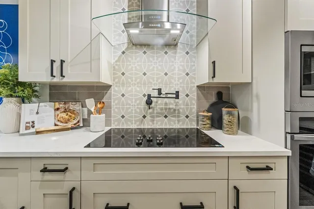 a view of a kitchen with cabinets and wooden floor