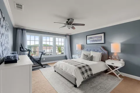 a bed room with a bed and a window