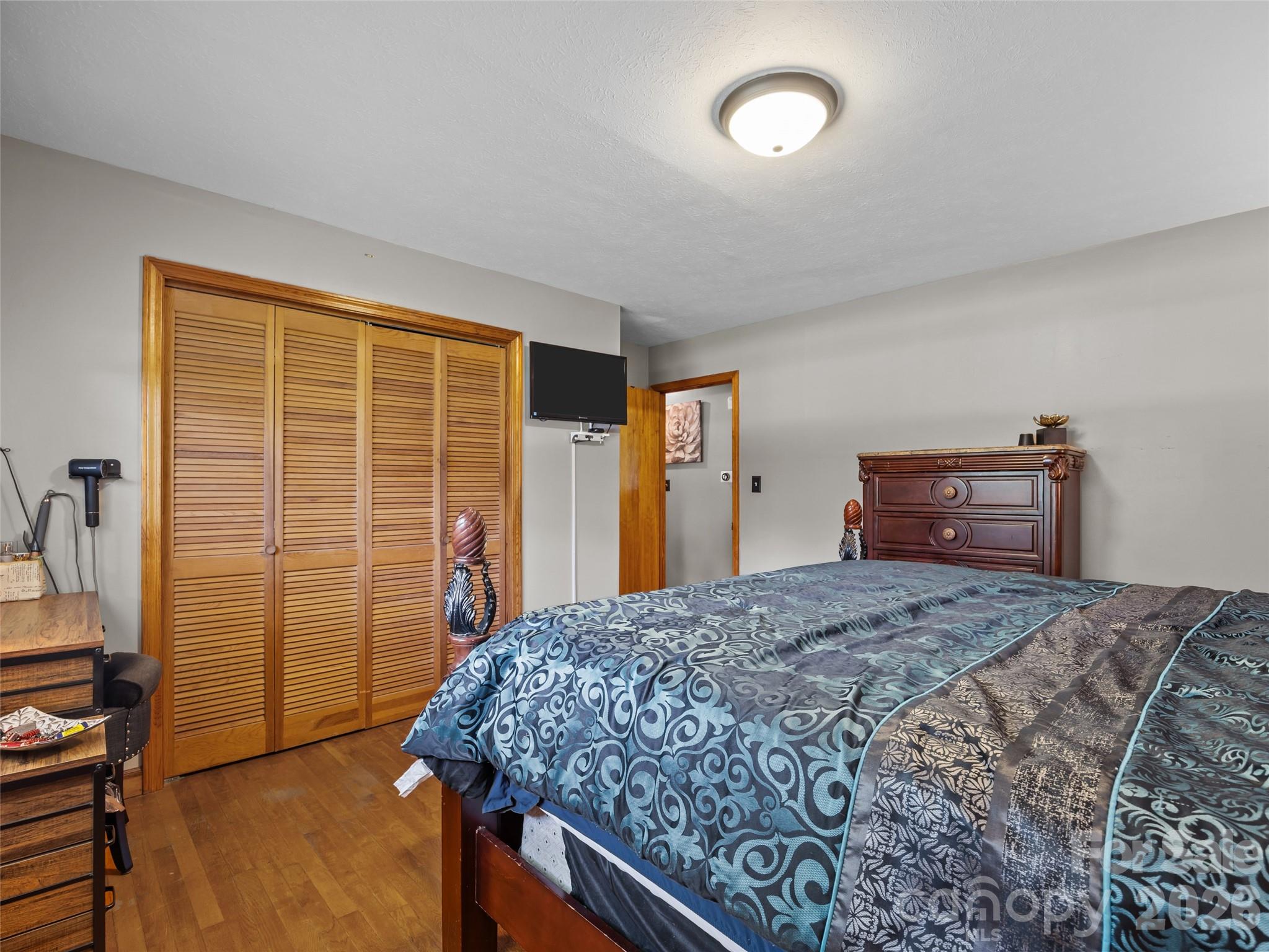 50 Baldwin Road Arden, NC 28704 - Photo 18 of 24 a bedroom with a bed and a dresser