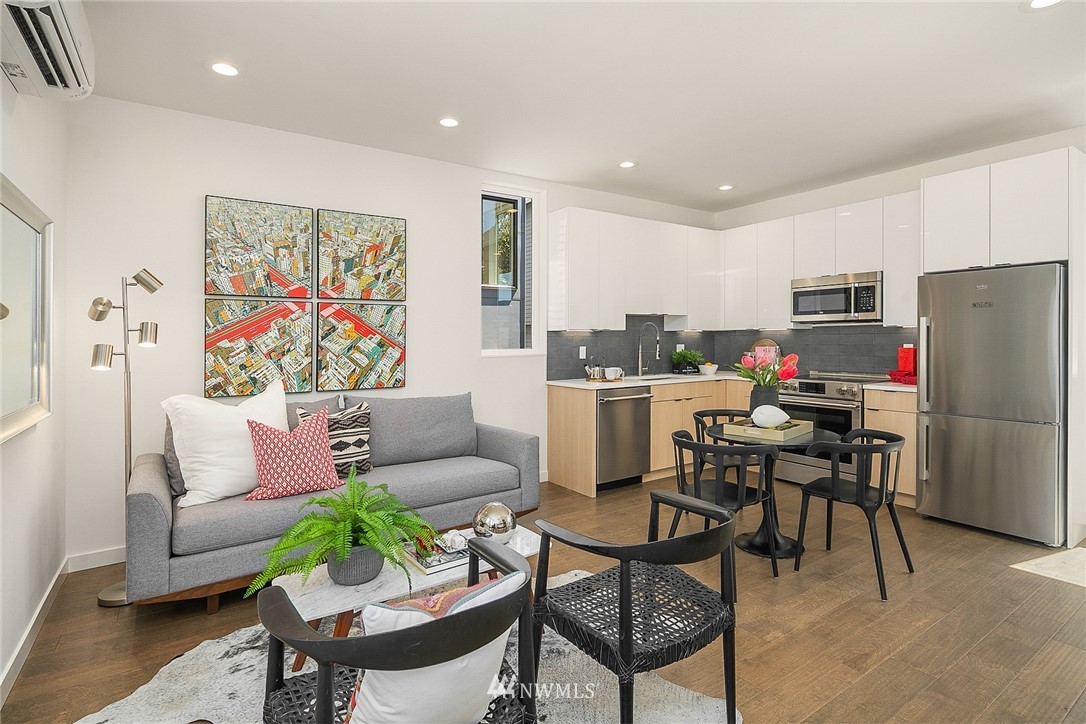 3664 Interlake Avenue North, Unit B Seattle, WA 98103 - Photo 6 of 13 a living room with furniture and kitchen view
