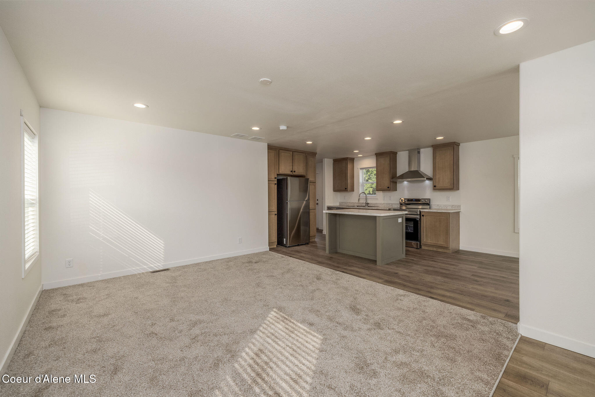 11474 North Alaska Loop Hayden, ID 83835 - Photo 6 of 23 LIVING ROOM WITH NEW FLOORING