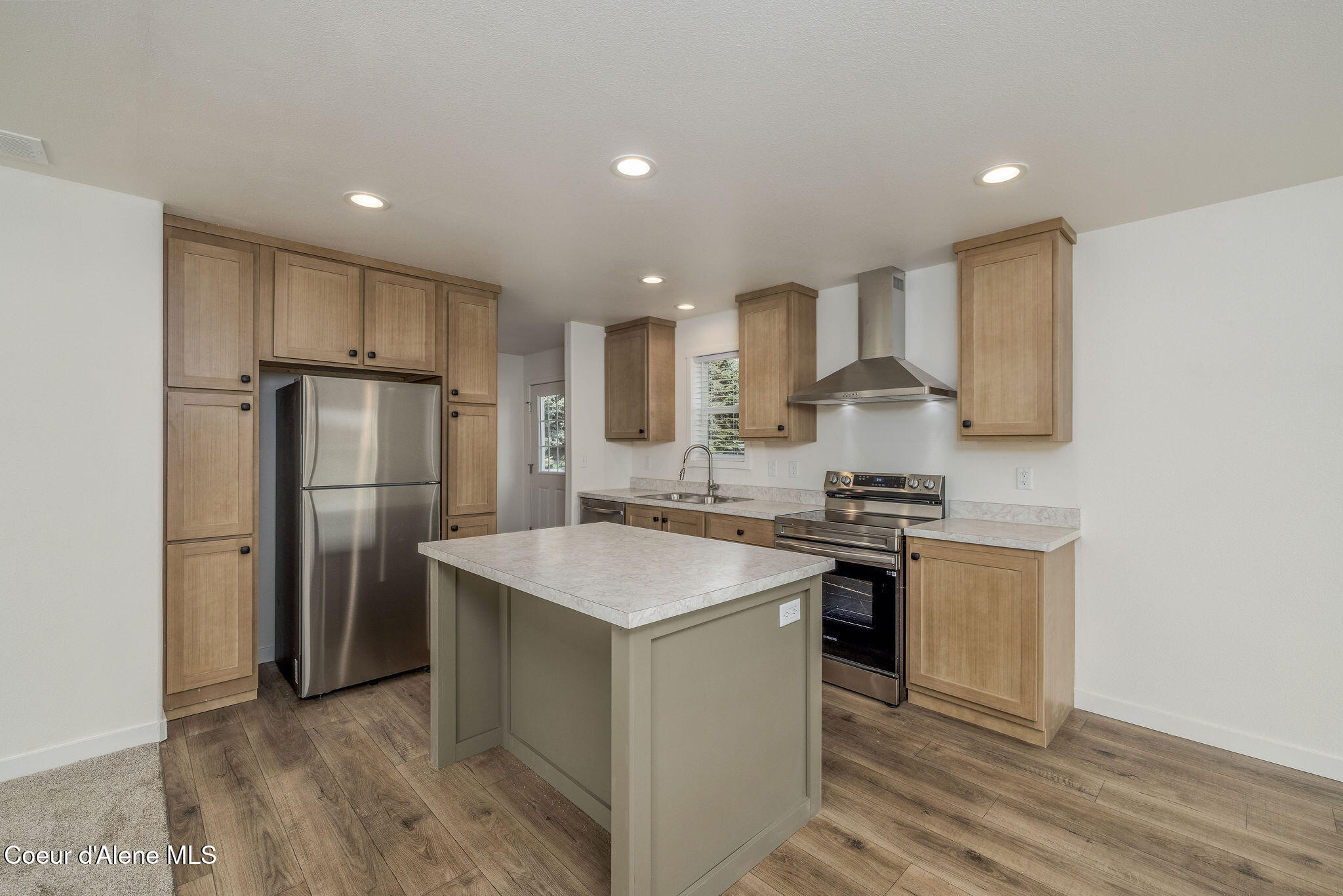 11474 North Alaska Loop Hayden, ID 83835 - Photo 10 of 23 BEAUTIFUL CABINETRY & KITCHEN ISLAND