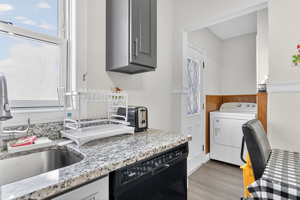 36-38 Mapleton Street Boston, MA 02135 - Photo 26 of 41 a kitchen that has a sink and a stove in it