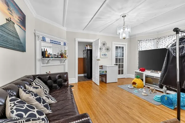 a bedroom with bed and a flat tv screen