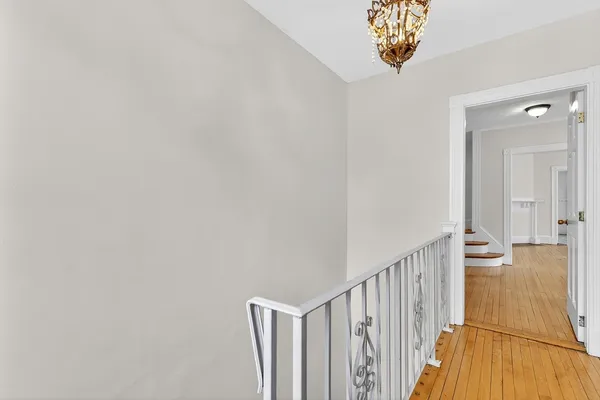 a view of a hallway with a chandelier