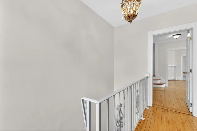 a view of a hallway with a chandelier