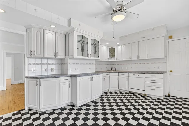 a kitchen with stainless steel appliances granite countertop a sink and cabinets