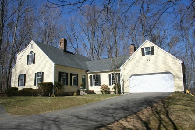 94 Bobbys Court Ridgefield, CT 06877 - Photo 1 of 1 a front view of a house with a yard