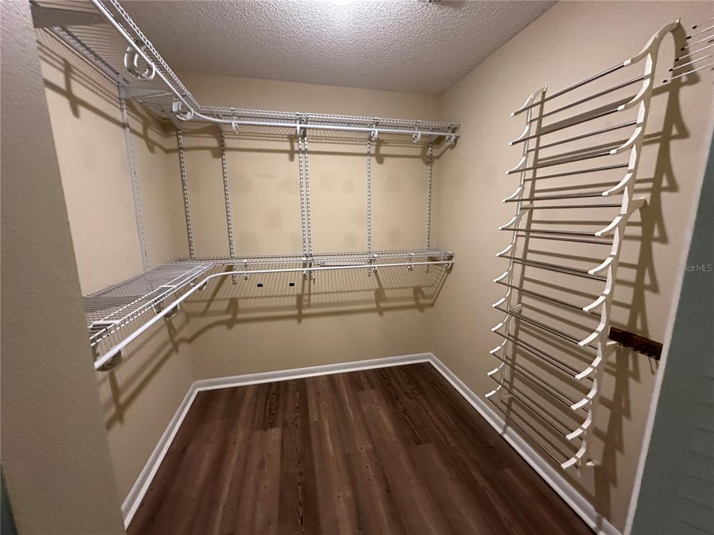 9157 Southwest 82nd Terrace, Unit C Ocala, FL 34481 - Photo 21 of 33 a view of a room with racks on the wall