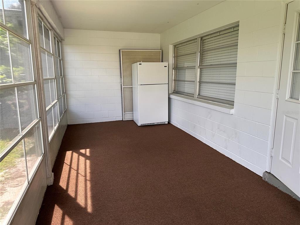 9157 Southwest 82nd Terrace, Unit C Ocala, FL 34481 - Photo 28 of 33 a view of an empty room with a window