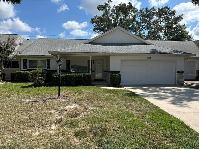 a house with trees in the background