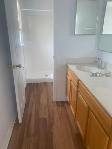 a view of a kitchen from a hallway