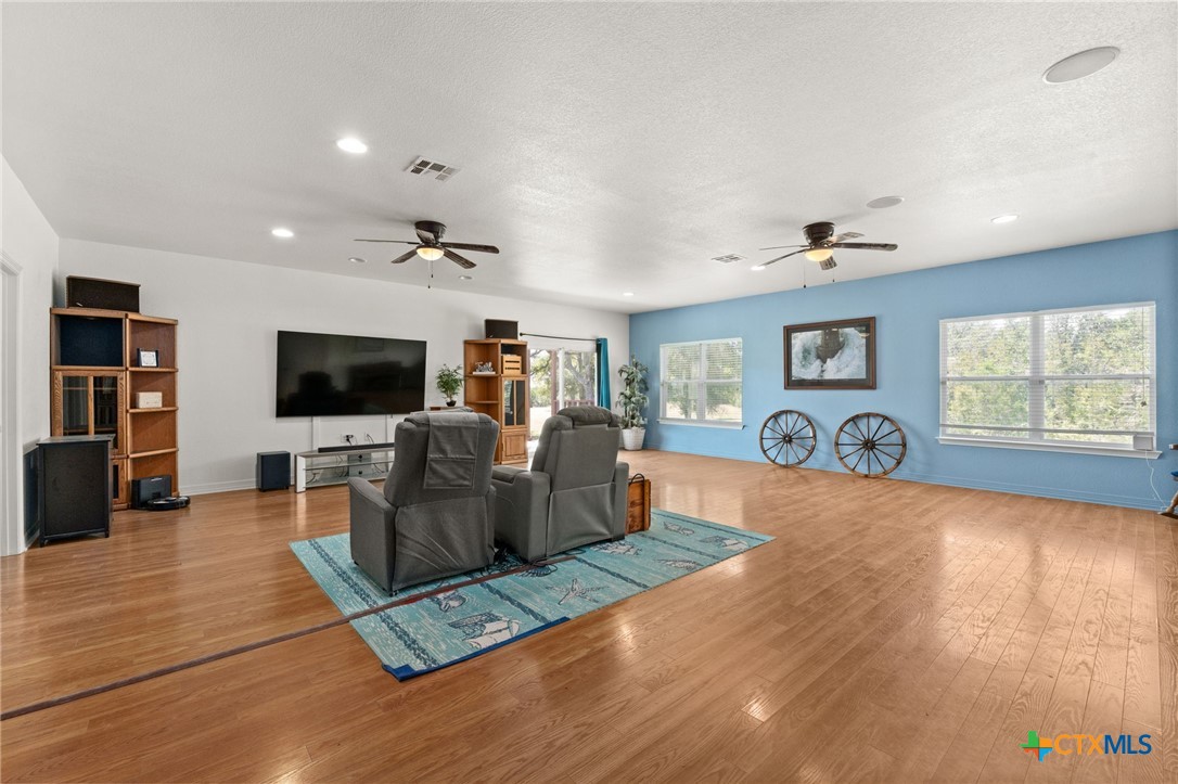 13061 Oakalla Road Killeen, TX 76549 - Photo 13 of 33 a living room with furniture and a flat screen tv