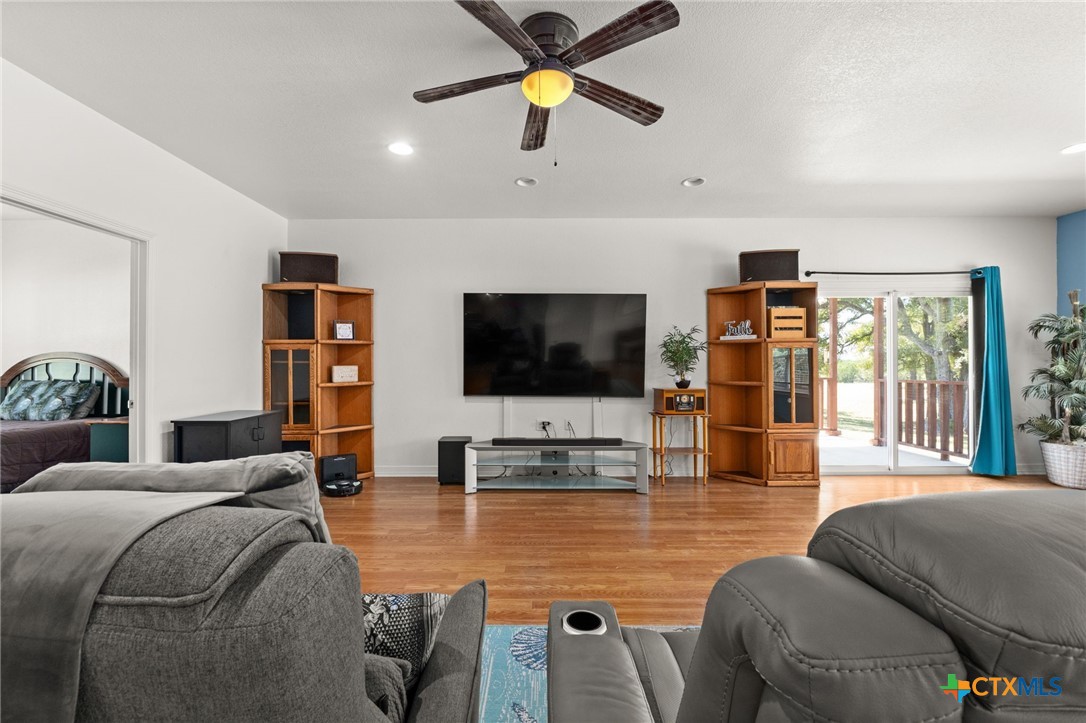 13061 Oakalla Road Killeen, TX 76549 - Photo 14 of 33 a living room with furniture and a flat screen tv