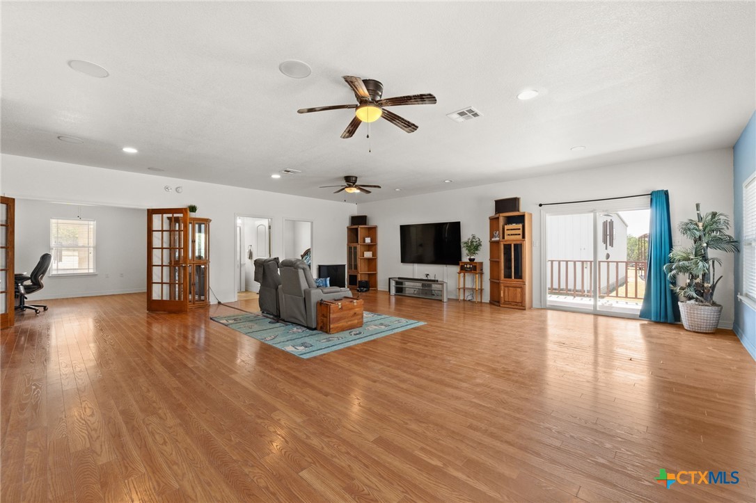 13061 Oakalla Road Killeen, TX 76549 - Photo 15 of 33 a living room with furniture and a wooden floor