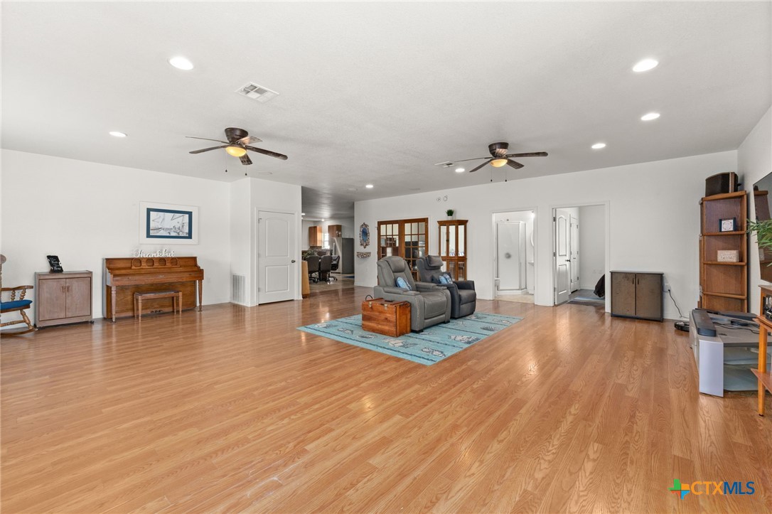 13061 Oakalla Road Killeen, TX 76549 - Photo 16 of 33 a living room with furniture and a flat screen tv