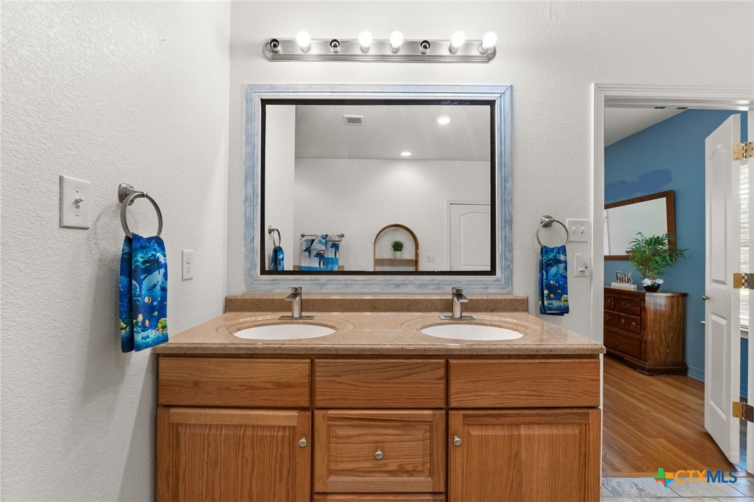 13061 Oakalla Road Killeen, TX 76549 - Photo 21 of 33 a bathroom with a sink and a mirror