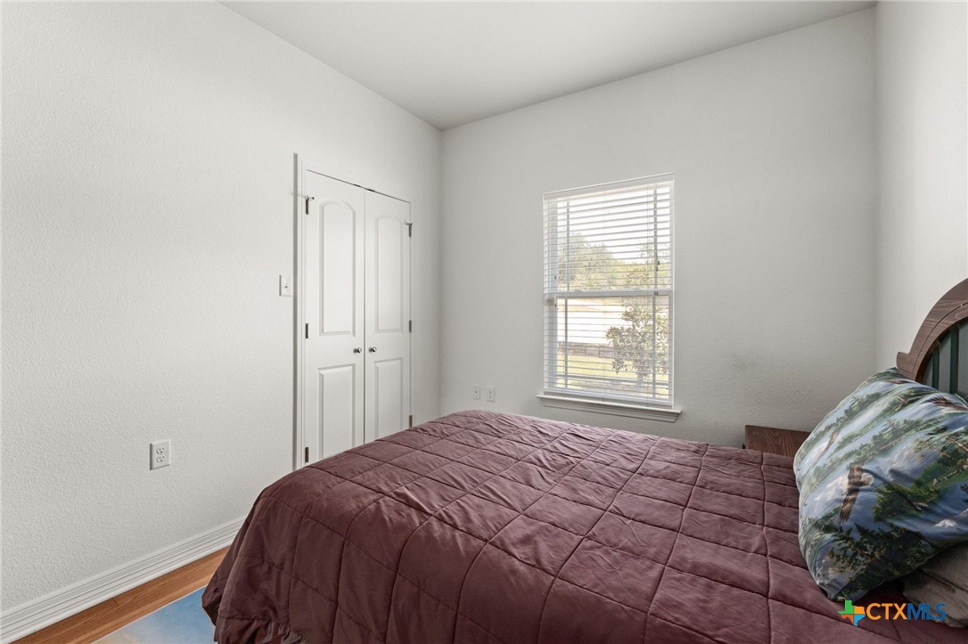 13061 Oakalla Road Killeen, TX 76549 - Photo 24 of 33 a bedroom with a bed and a window