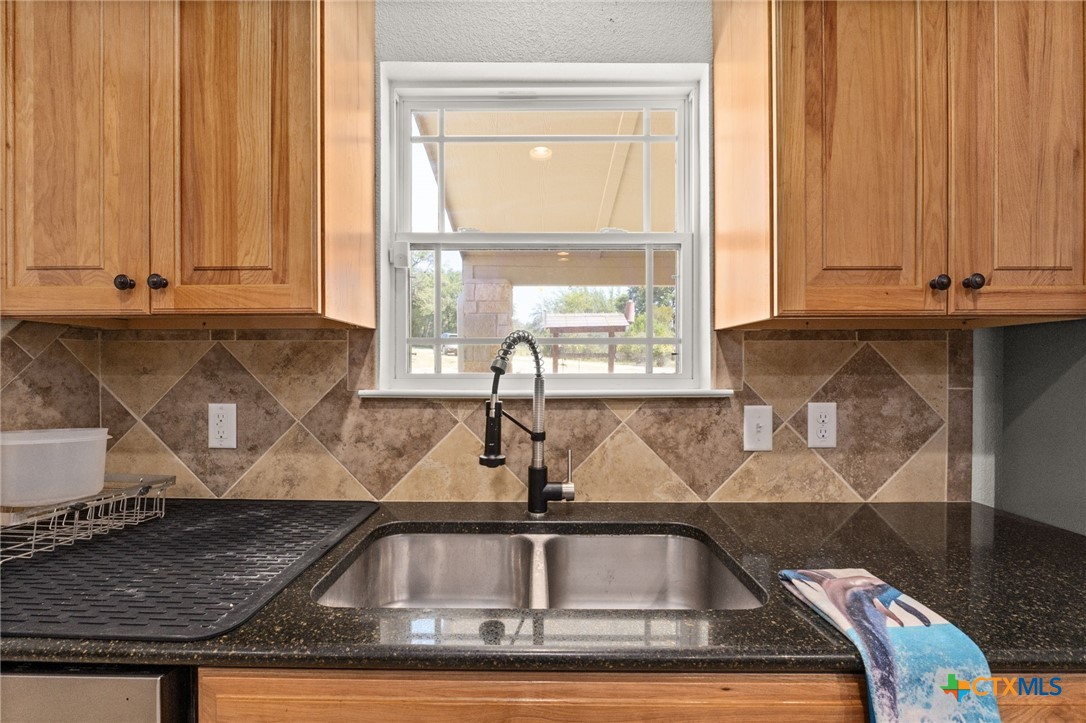 13061 Oakalla Road Killeen, TX 76549 - Photo 9 of 33 a view of kitchen with granite countertop a window