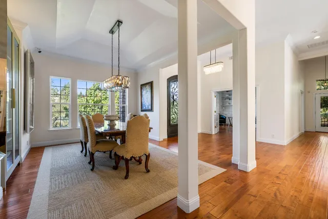 a kitchen with stainless steel appliances granite countertop a sink and a stove