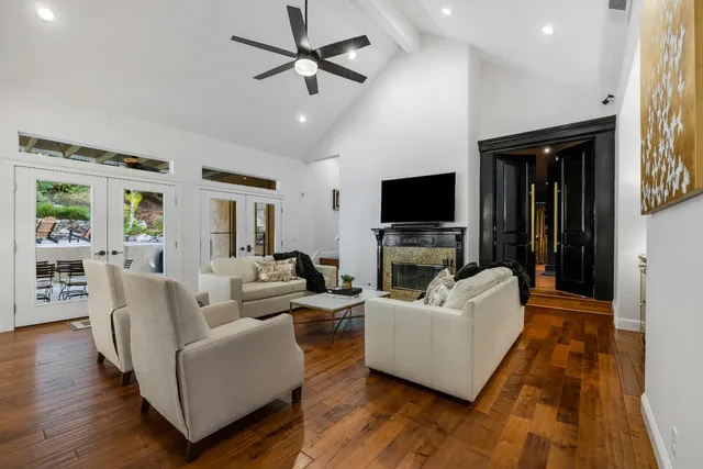 a en suite bathroom with a double vanity sink a mirror and a bathtub