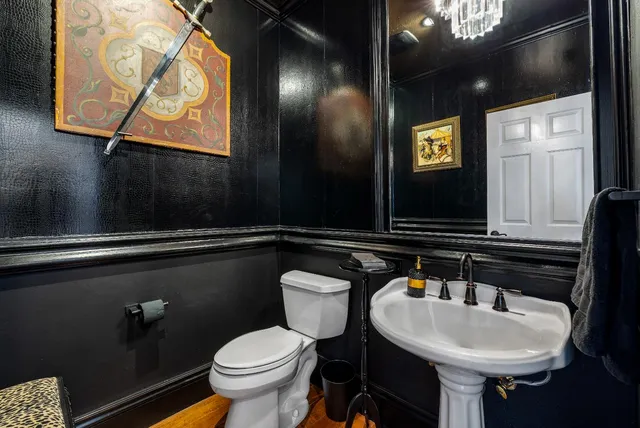 a bedroom with furniture and a chandelier