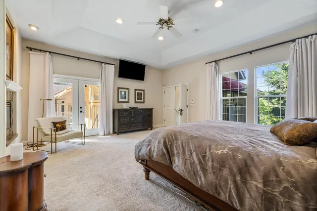 a view of a patio with table and chairs and potted plants