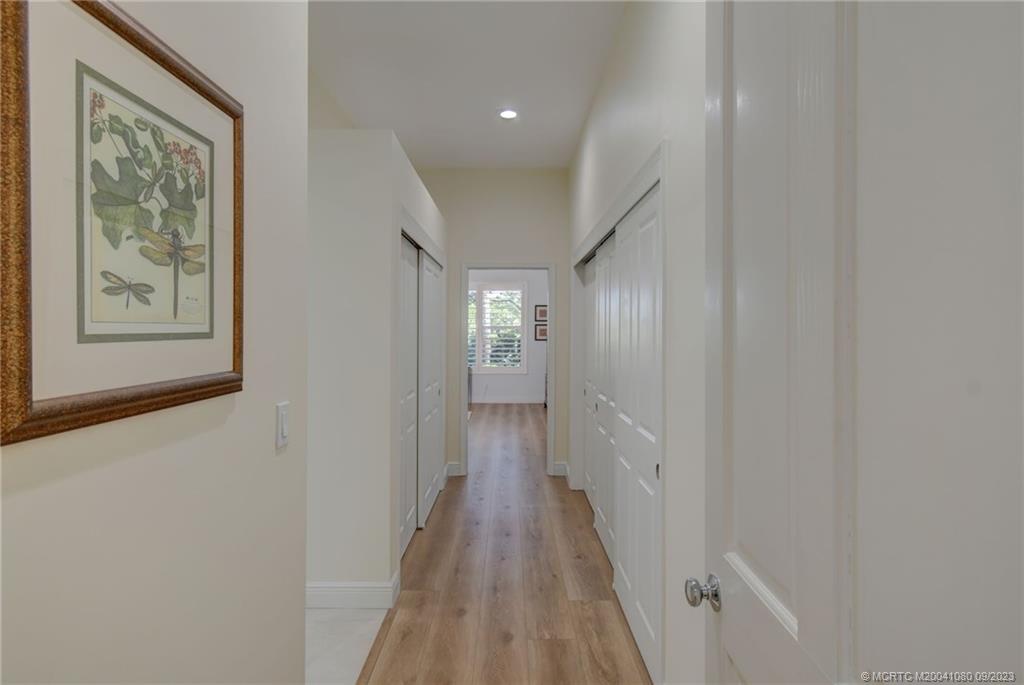 3531 Southeast Cambridge Drive Stuart, FL 34997 - Photo 17 of 44 a view of a hallway with wooden floor and closet
