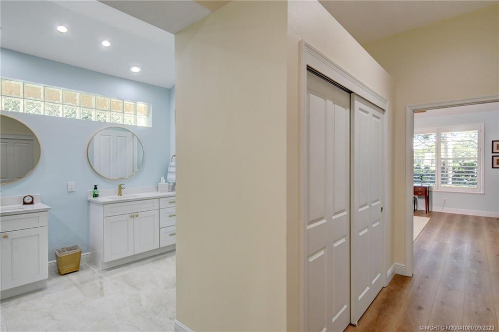 3531 Southeast Cambridge Drive Stuart, FL 34997 - Photo 18 of 44 a room with mirror and window