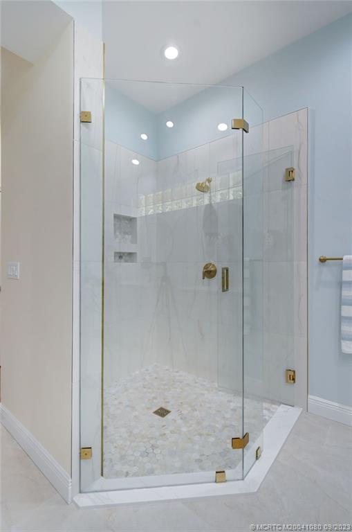 3531 Southeast Cambridge Drive Stuart, FL 34997 - Photo 22 of 44 a bathroom with a shower